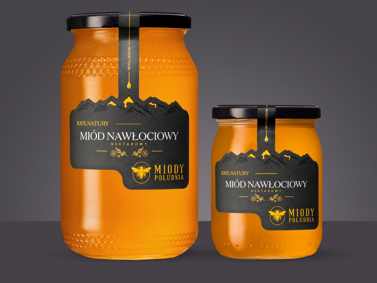 Dwa słoiki płynnego miodu nawłociowego